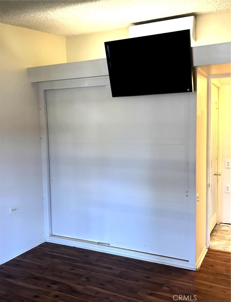 1075 Brookline Road, Unit M9220E Seal Beach, CA 90740 - Photo 10 of 16 a view of empty room with wooden floor