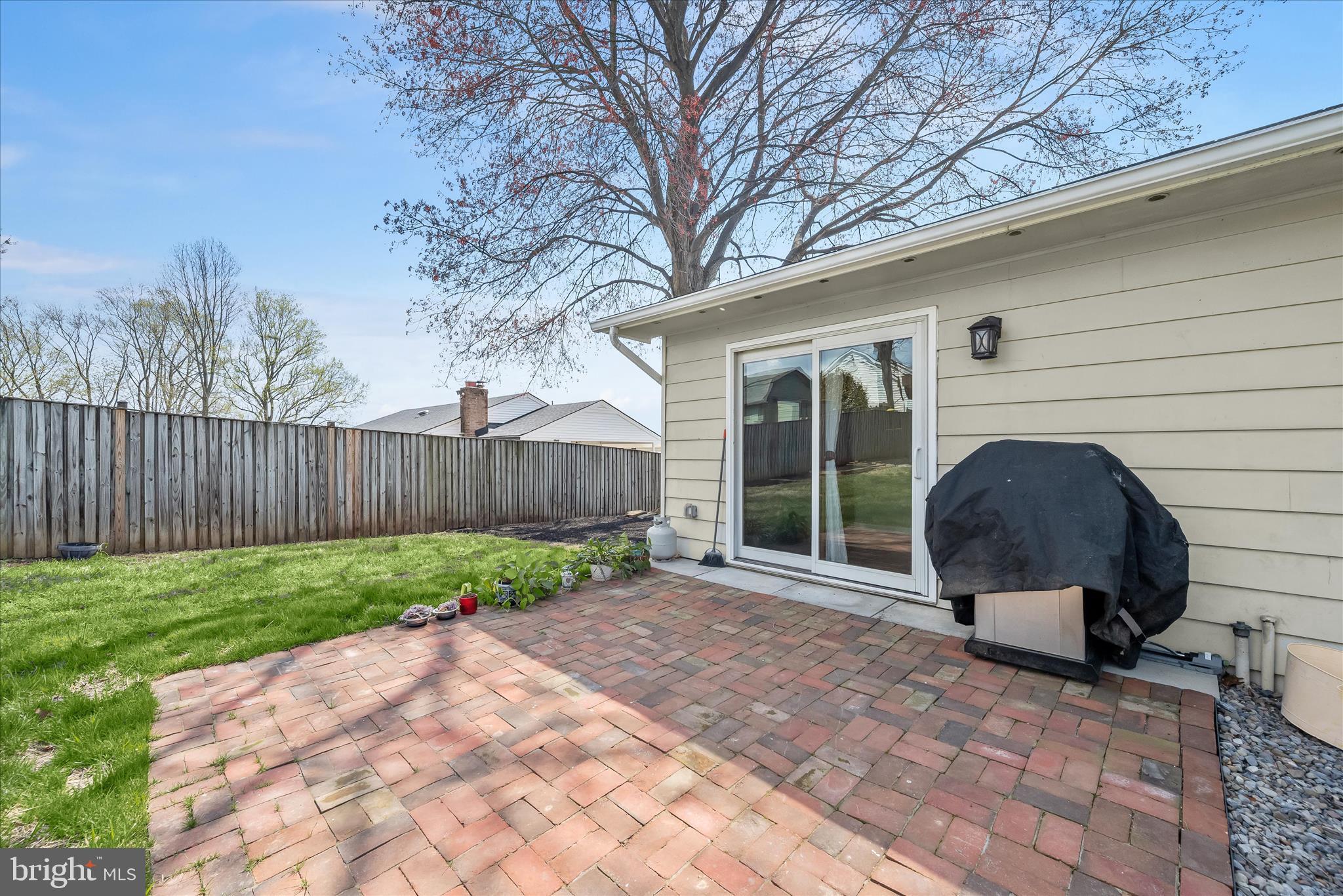 14821 Ridge Oak Drive Boyds, MD 20841 - Photo 40 of 49 a view of a chair and table in backyard of the house