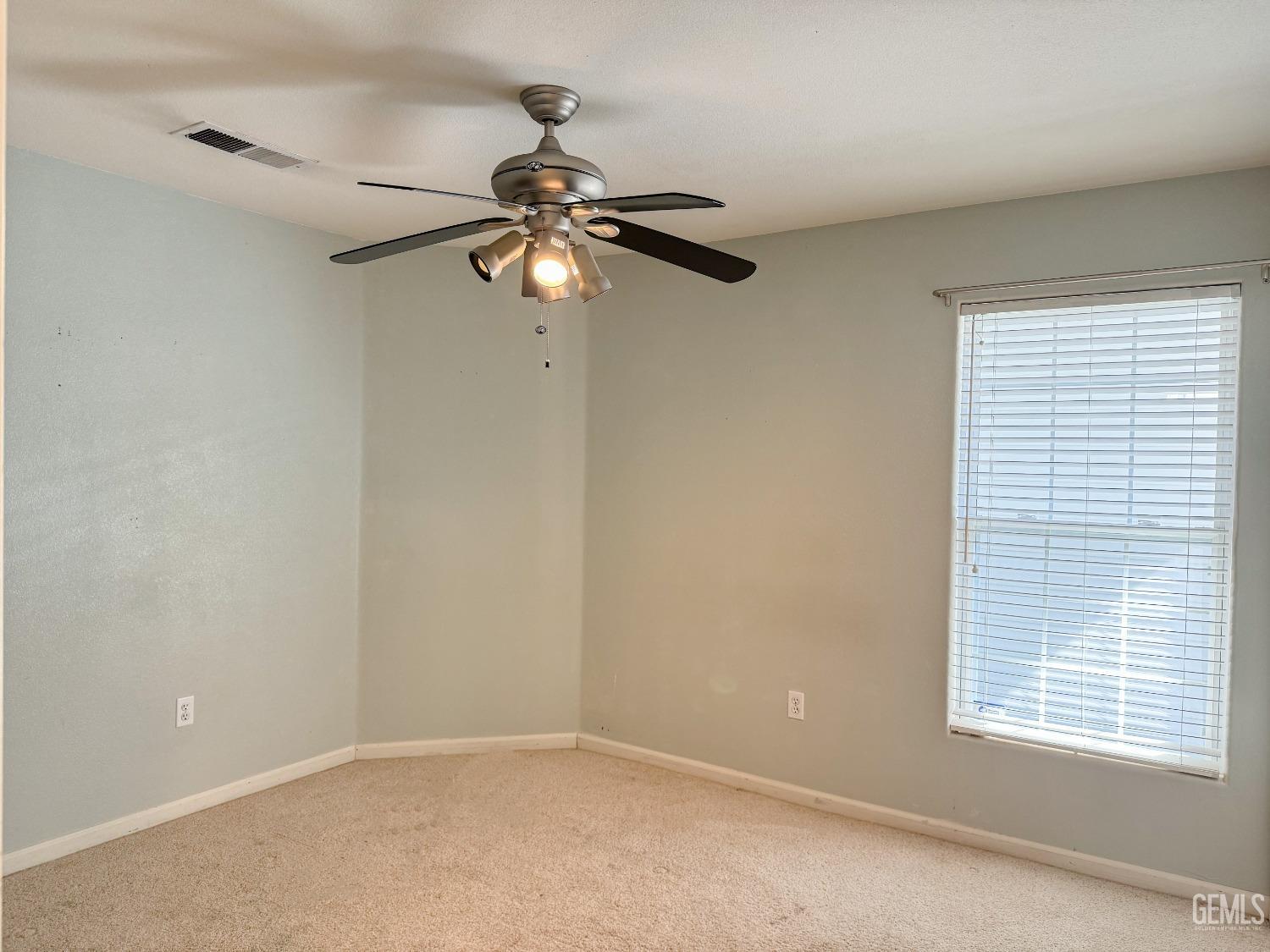 Undisclosed Address Bakersfield, CA 93312 - Photo 18 of 32 a view of room with a ceiling fan and window