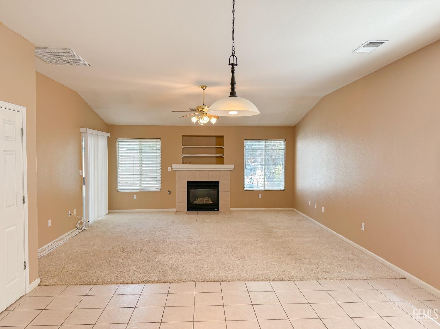 Undisclosed Address Bakersfield, CA 93312 - Photo 2 of 32 a view of an empty room with window and chandelier