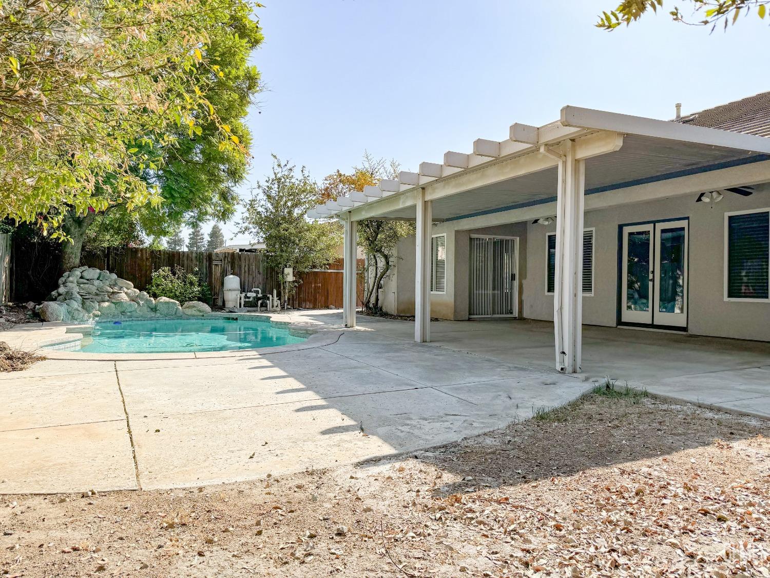 Undisclosed Address Bakersfield, CA 93312 - Photo 28 of 32 a view of a house with a yard and plants