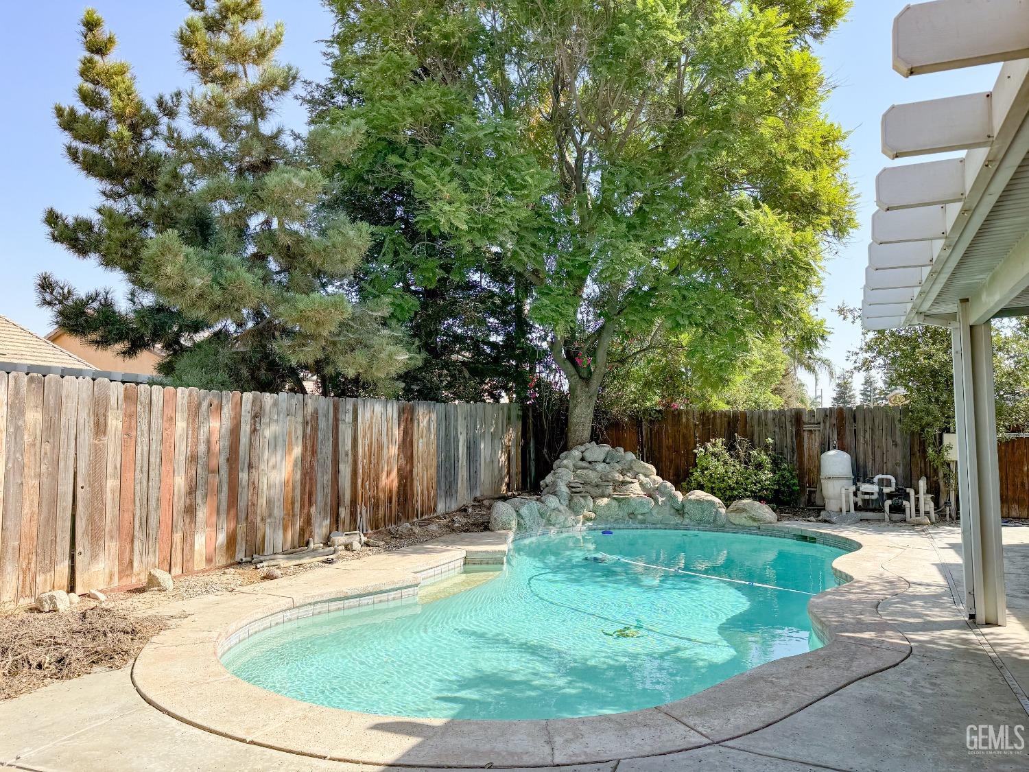 Undisclosed Address Bakersfield, CA 93312 - Photo 29 of 32 a backyard of a house with table and chairs