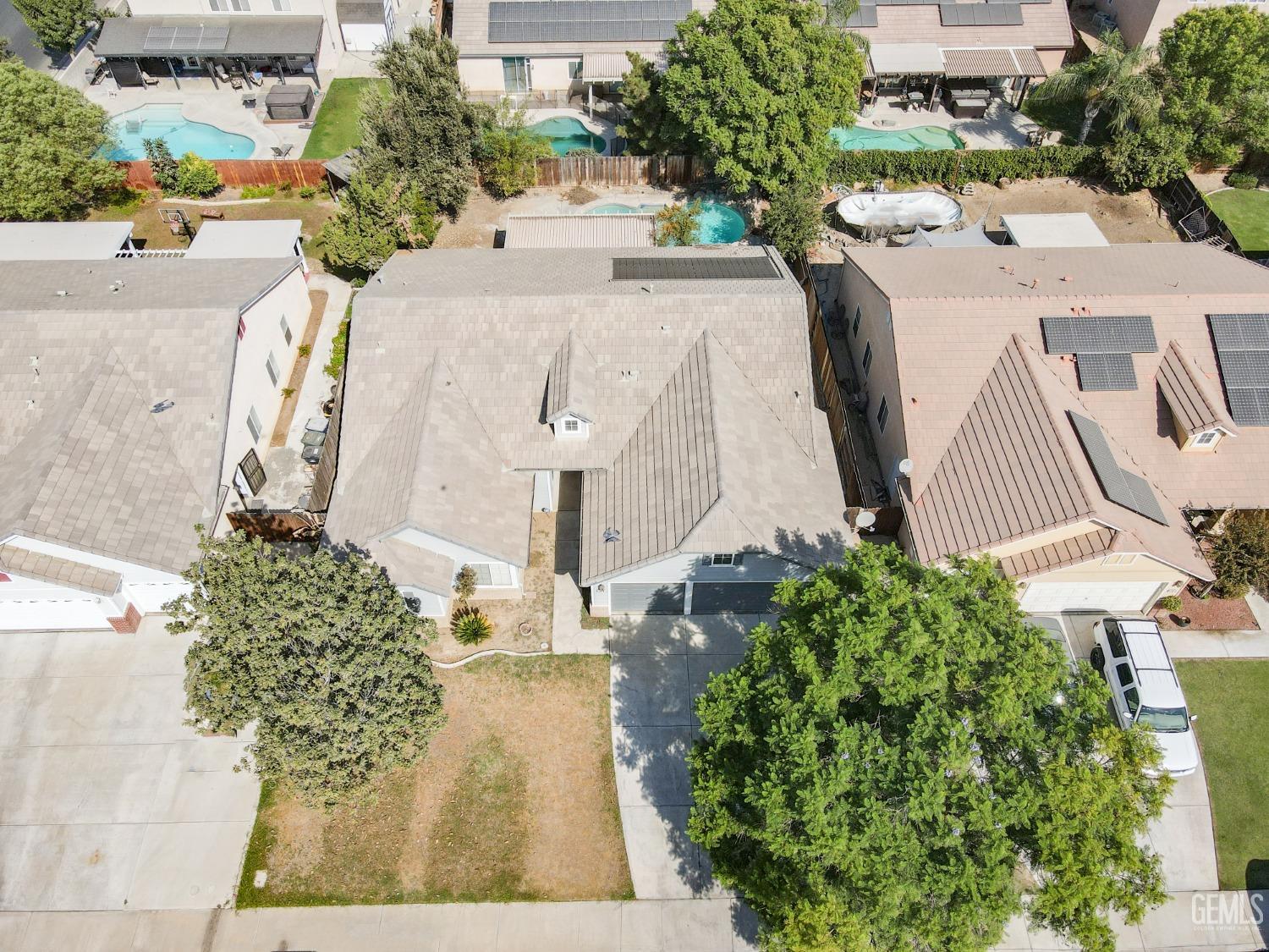 Undisclosed Address Bakersfield, CA 93312 - Photo 32 of 32 an aerial view of a house with a garden and trees
