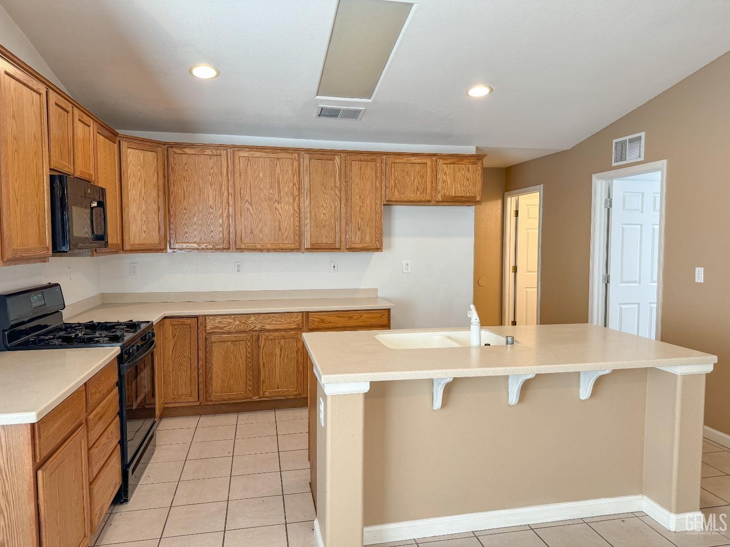Undisclosed Address Bakersfield, CA 93312 - Photo 4 of 32 a kitchen with stainless steel appliances granite countertop a sink a stove and a refrigerator