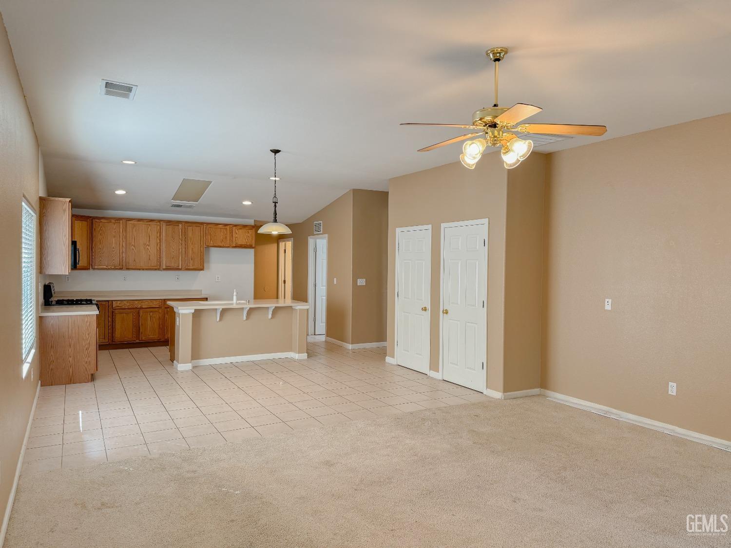 Undisclosed Address Bakersfield, CA 93312 - Photo 7 of 32 a view of a kitchen with a sink and a refrigerator