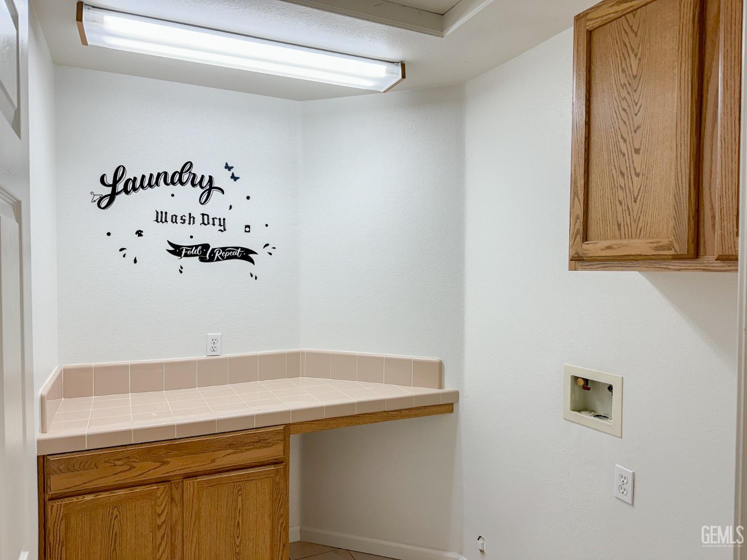 Undisclosed Address Bakersfield, CA 93312 - Photo 8 of 32 a bathroom with a sink and a mirror