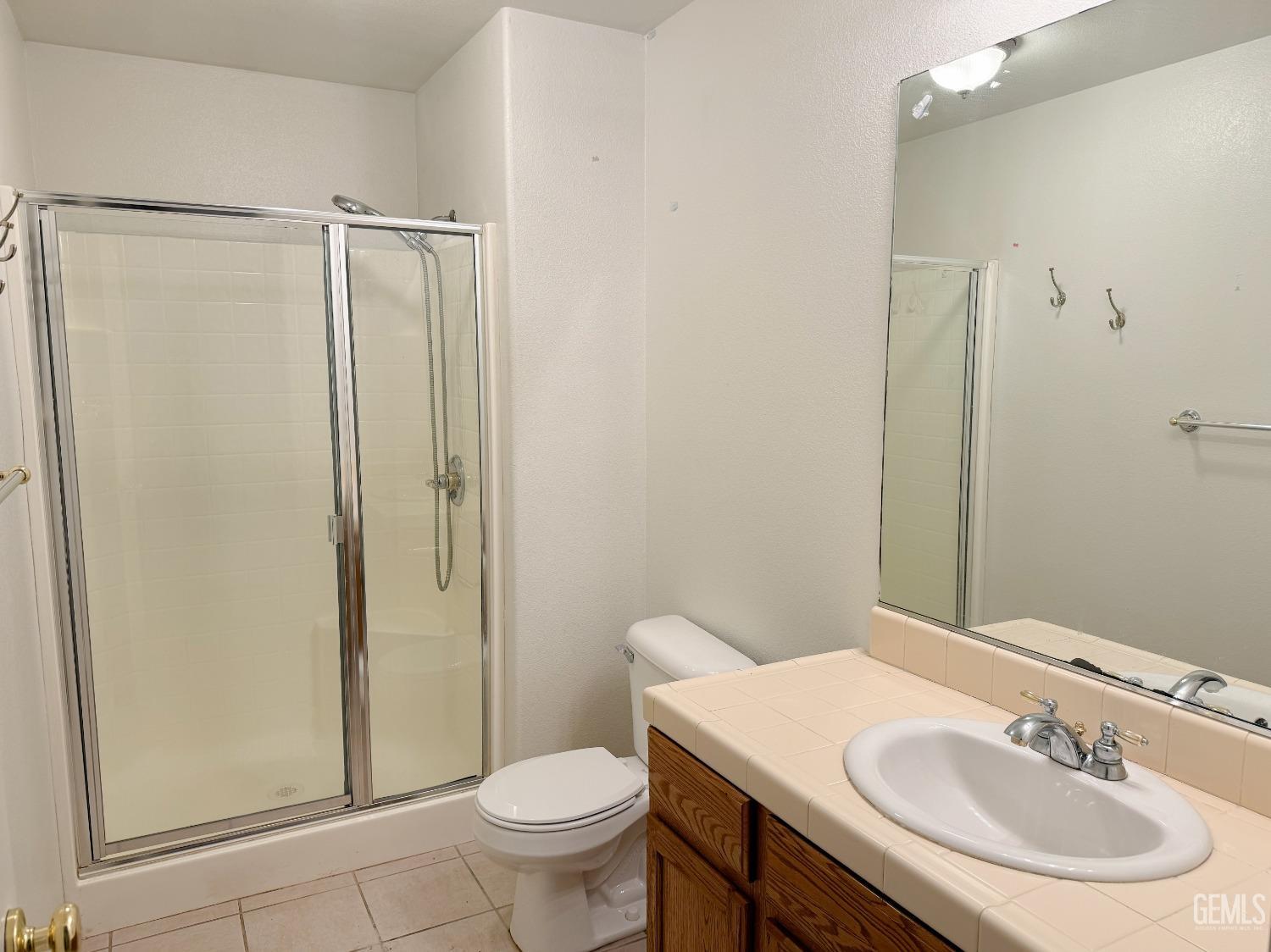 Undisclosed Address Bakersfield, CA 93312 - Photo 9 of 32 a bathroom with a sink toilet and shower