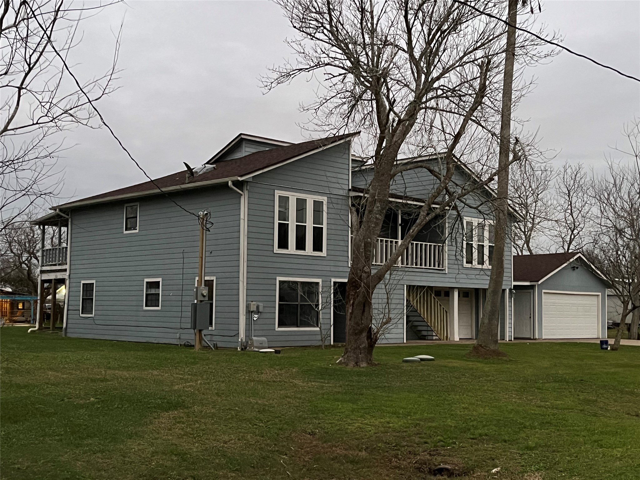 12022 Annette Road, Unit CR657 Angleton, TX 77515 - Photo 2 of 26 a front view of a house with a garden