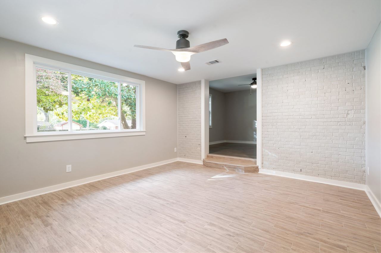 480 Chalmers Road Memphis, TN 38120 - Photo 22 of 25 an empty room with wooden floor and windows
