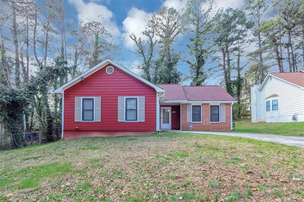 5325 Brentwood Road Atlanta, GA 30349 - Photo 1 of 1 a front view of a house with garden