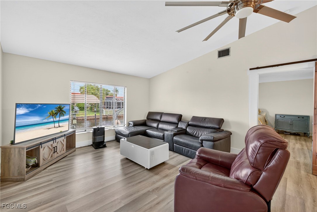 1823 Stevenson Road North Fort Myers, FL 33917 - Photo 11 of 32 a living room with furniture and a flat screen tv