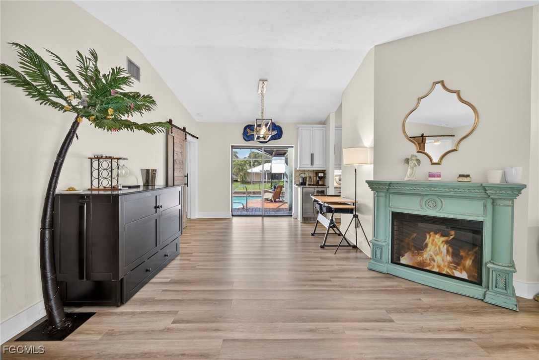 1823 Stevenson Road North Fort Myers, FL 33917 - Photo 13 of 32 a living room with furniture and a fireplace