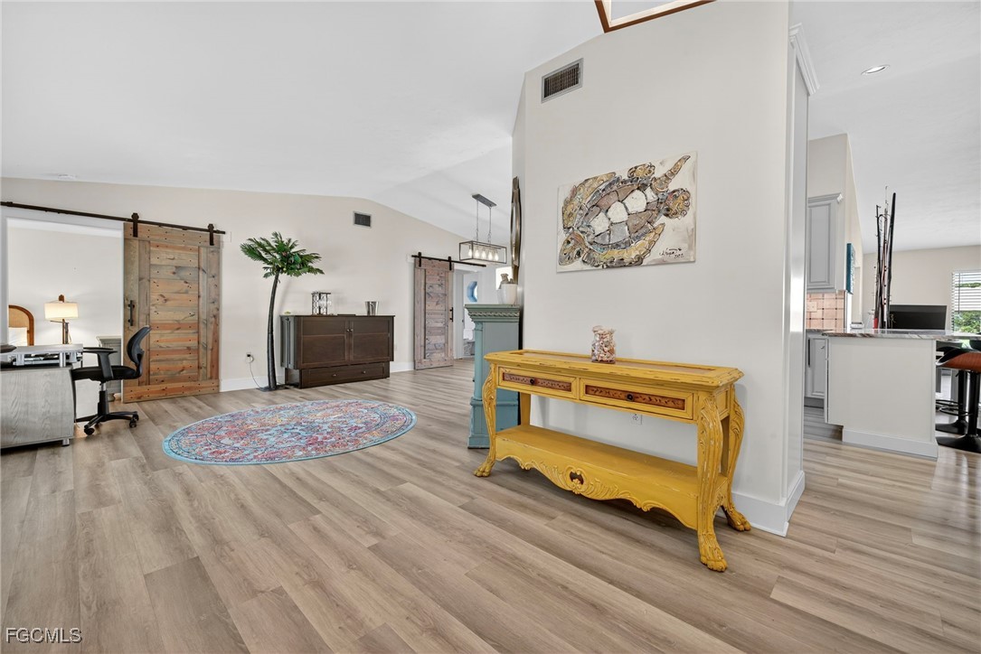 1823 Stevenson Road North Fort Myers, FL 33917 - Photo 15 of 32 a bedroom with furniture and a wooden floor