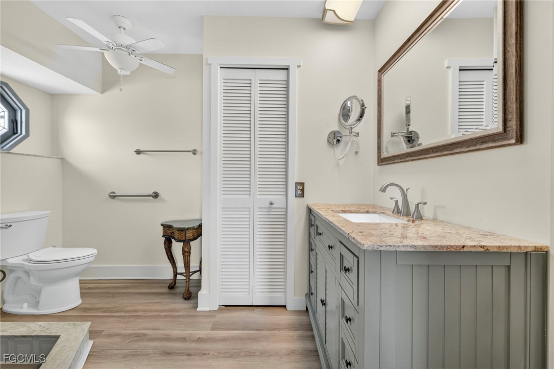 1823 Stevenson Road North Fort Myers, FL 33917 - Photo 19 of 32 a bathroom with a granite countertop sink toilet and shower