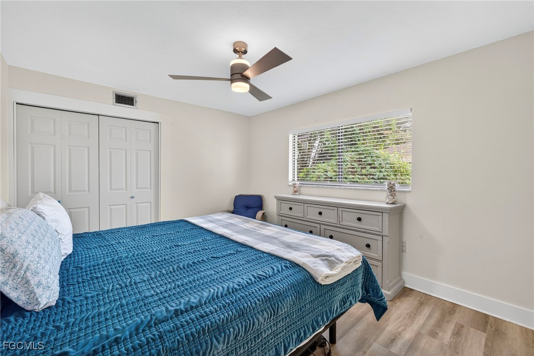 1823 Stevenson Road North Fort Myers, FL 33917 - Photo 21 of 32 a bedroom with a bed and a window
