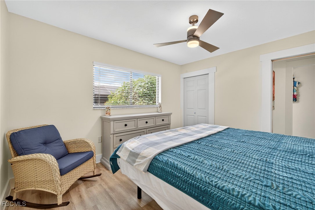 1823 Stevenson Road North Fort Myers, FL 33917 - Photo 22 of 32 a bedroom with a bed couch and window