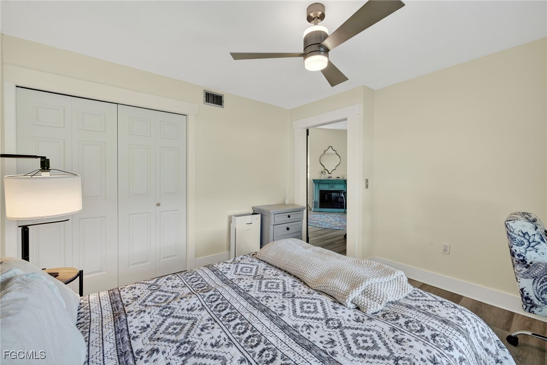 1823 Stevenson Road North Fort Myers, FL 33917 - Photo 24 of 32 a bedroom with a bed and a lamp