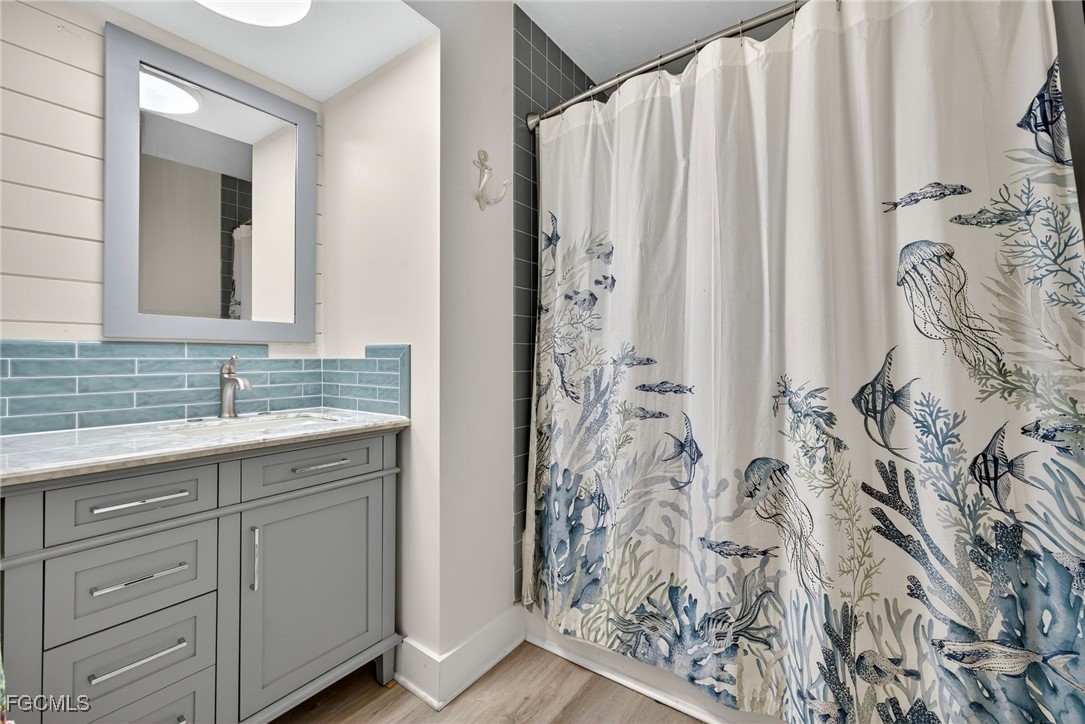 1823 Stevenson Road North Fort Myers, FL 33917 - Photo 25 of 32 a bathroom with a granite countertop sink and a mirror