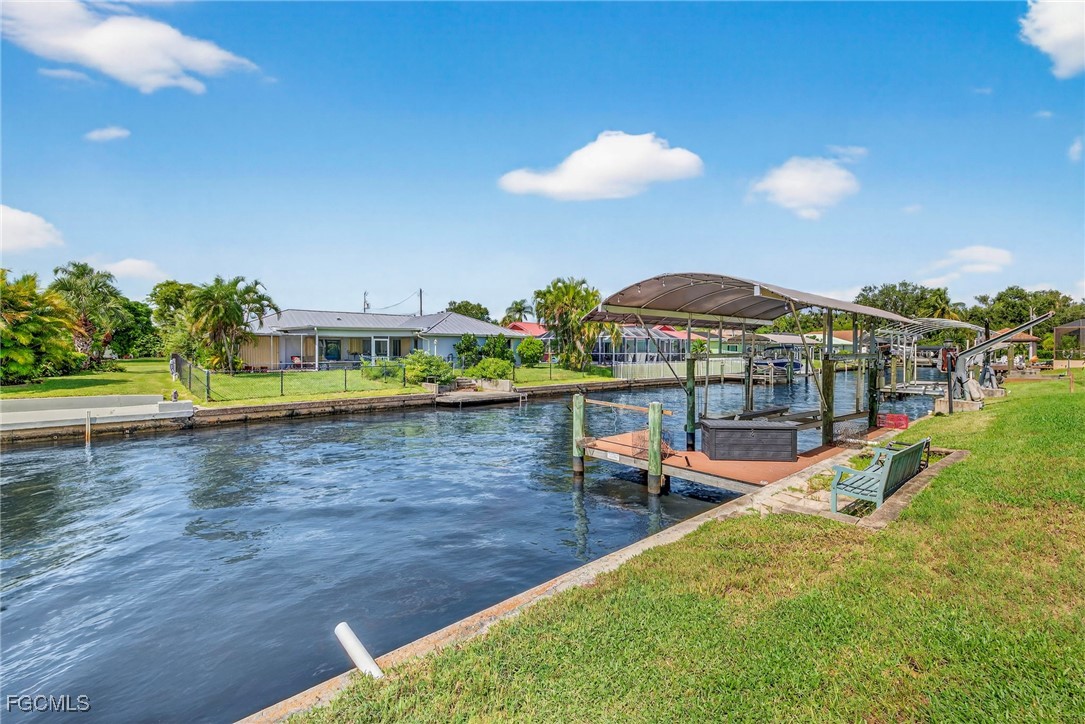 1823 Stevenson Road North Fort Myers, FL 33917 - Photo 29 of 32 a view of a swimming pool with a table and chairs