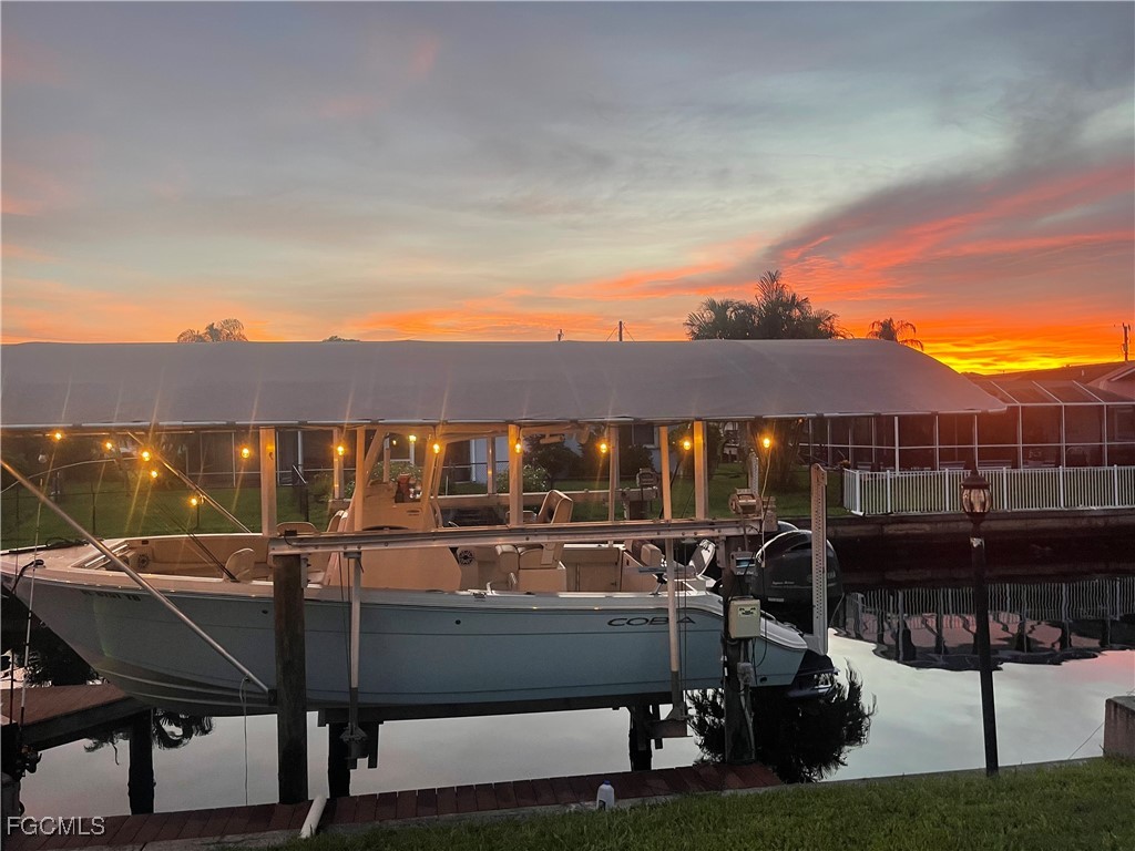 1823 Stevenson Road North Fort Myers, FL 33917 - Photo 30 of 32 a view of a patio with table and chairs and potted plants