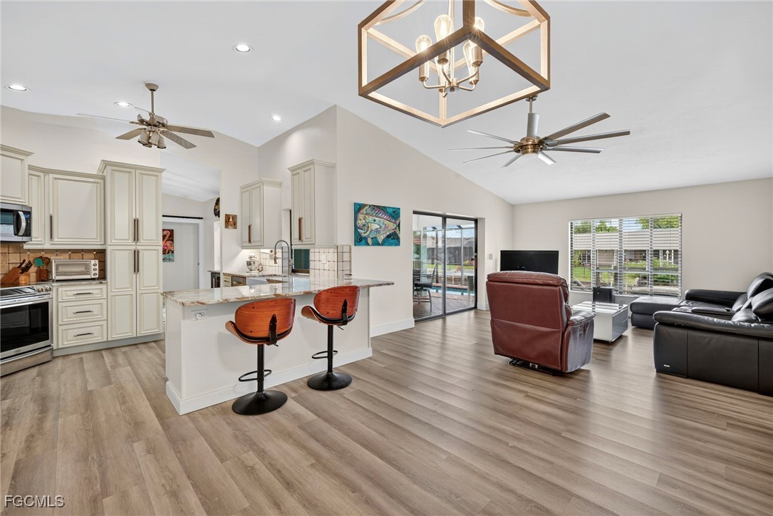 1823 Stevenson Road North Fort Myers, FL 33917 - Photo 3 of 32 a living room with furniture and a wooden floor