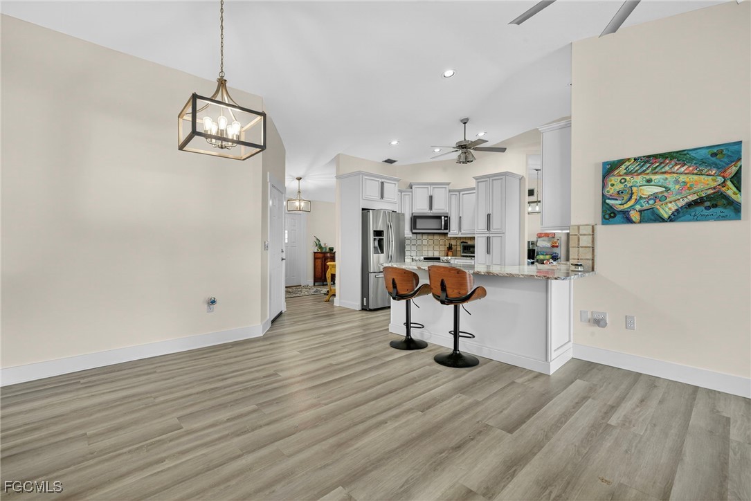 1823 Stevenson Road North Fort Myers, FL 33917 - Photo 8 of 32 a view of a room with wooden floor and furniture