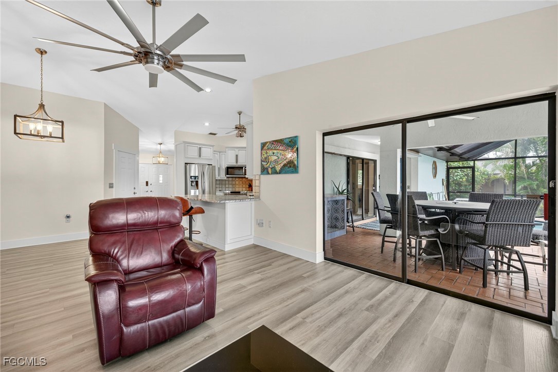 1823 Stevenson Road North Fort Myers, FL 33917 - Photo 9 of 32 a living room with furniture and wooden floor