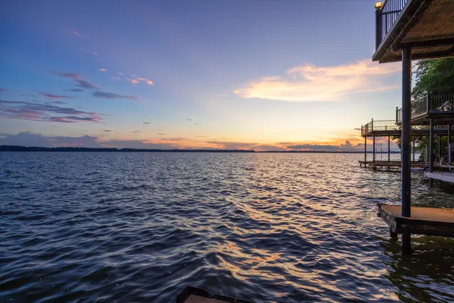 a view of a lake with a yard