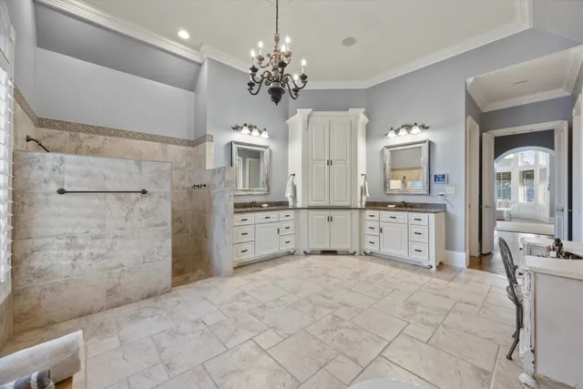 a kitchen with cabinets and stainless steel appliances