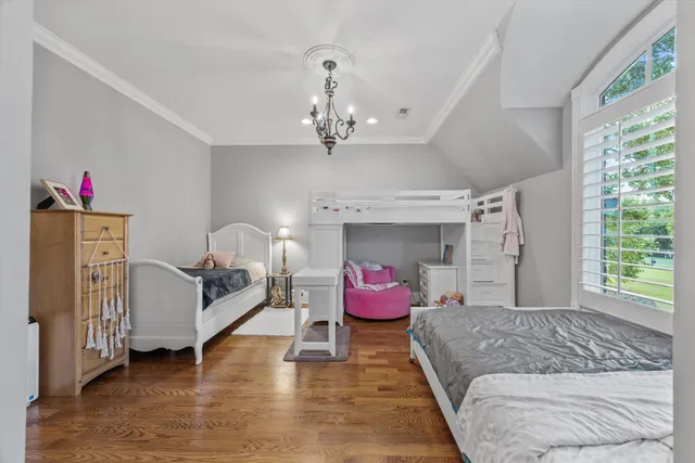 a front view of a house with a yard table and chairs