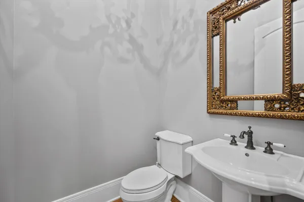 an aerial view of a house with garden space and street view