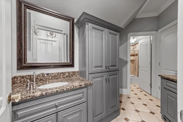 a view of a big house with a big yard and large trees