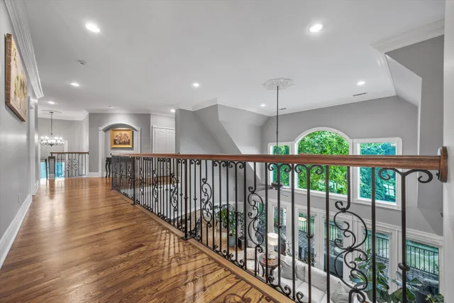 a front view of a house with a yard and a garden