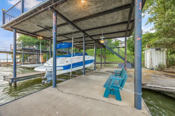 a living room with fireplace furniture and a wooden floor