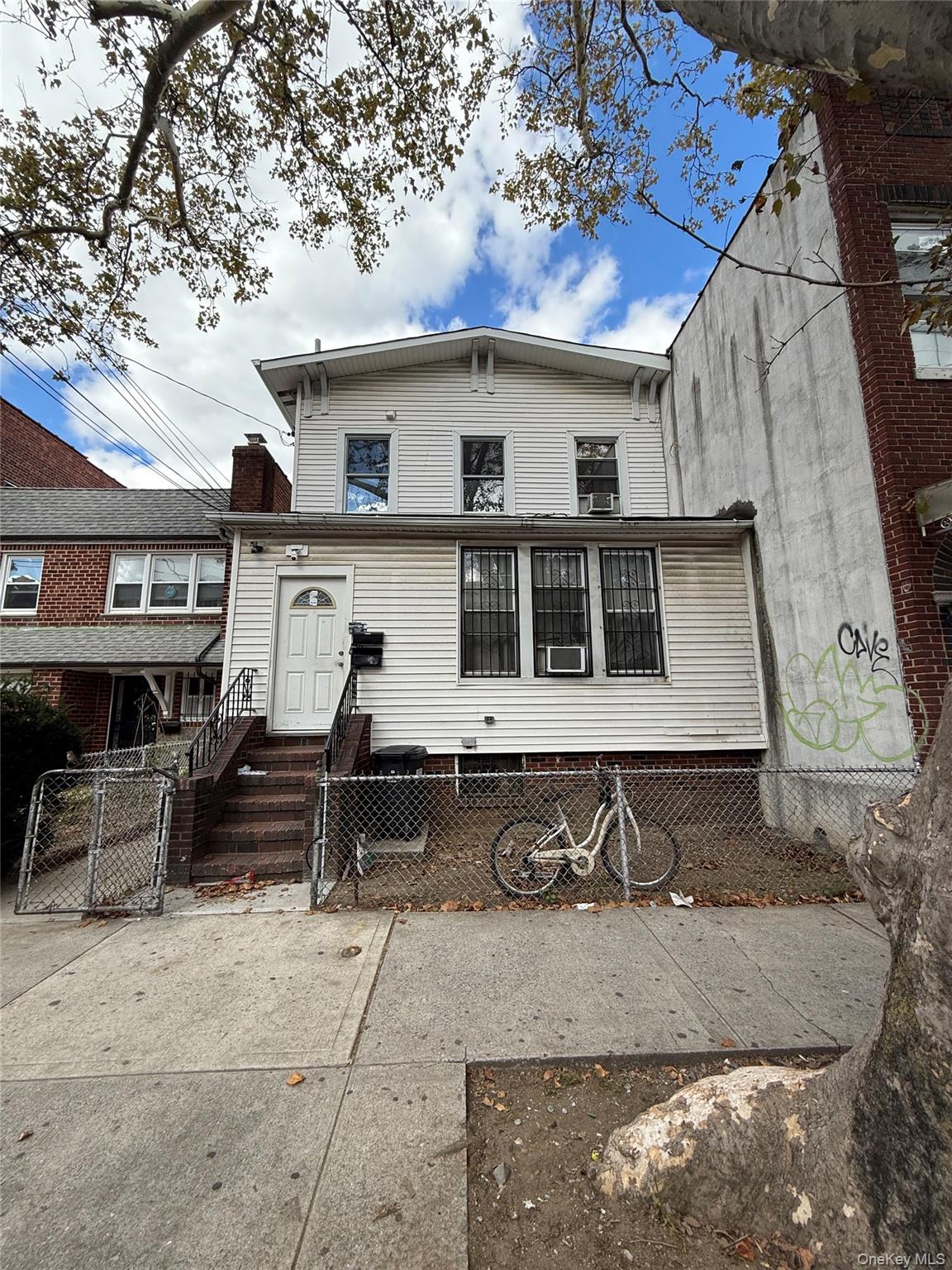 a front view of a house with parking area