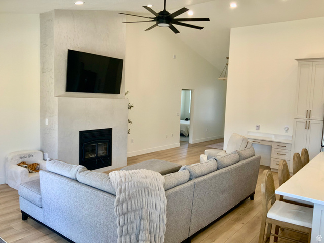 277 West 800 South Monroe, UT 84754 - Photo 6 of 46 Living room featuring a ceiling fan, light wood-style flooring, a premium fireplace, vaulted ceiling, and recessed lighting