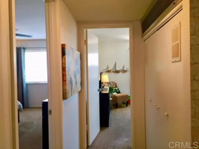 a view of a bedroom from a hallway