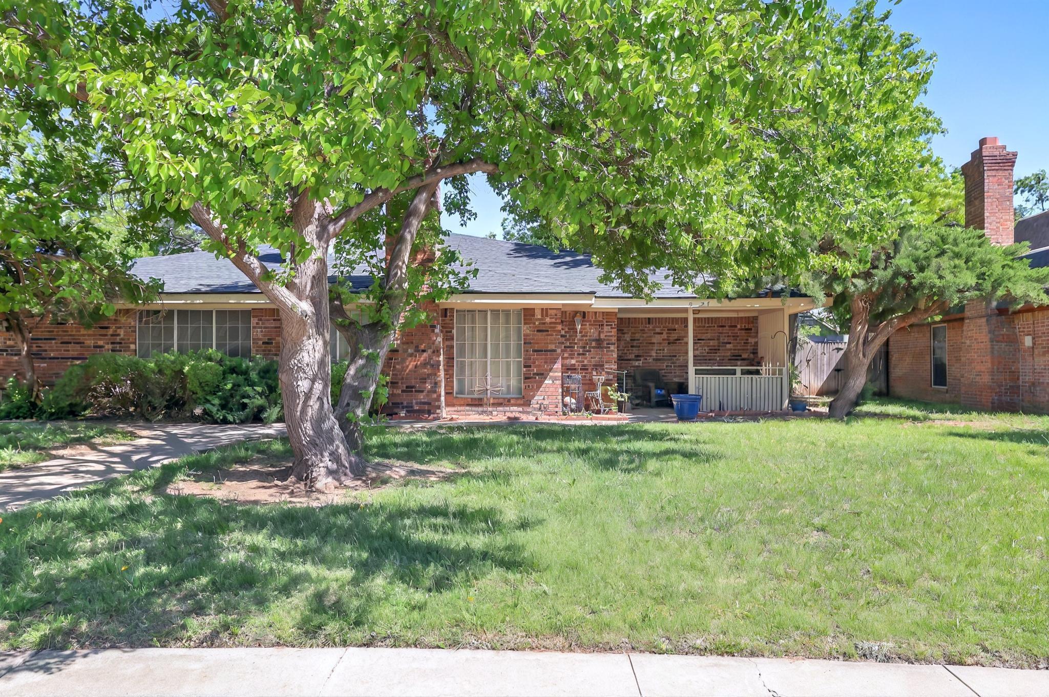 6225-6227 Belpree Road Amarillo, TX 79106 - Photo 16 of 31 a front view of a house with garden