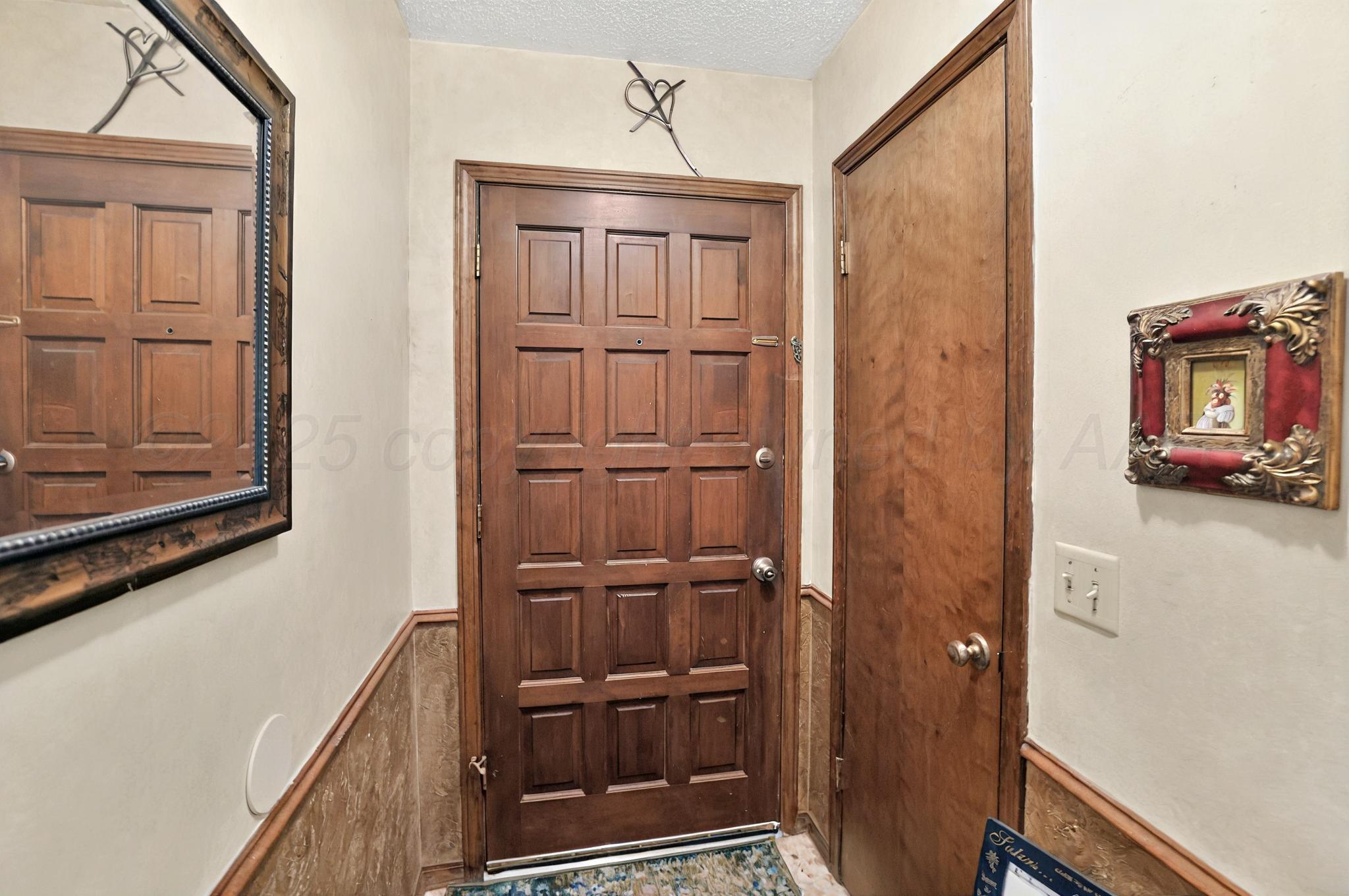 6225-6227 Belpree Road Amarillo, TX 79106 - Photo 17 of 31 a view of a hallway with wooden floor and entryway