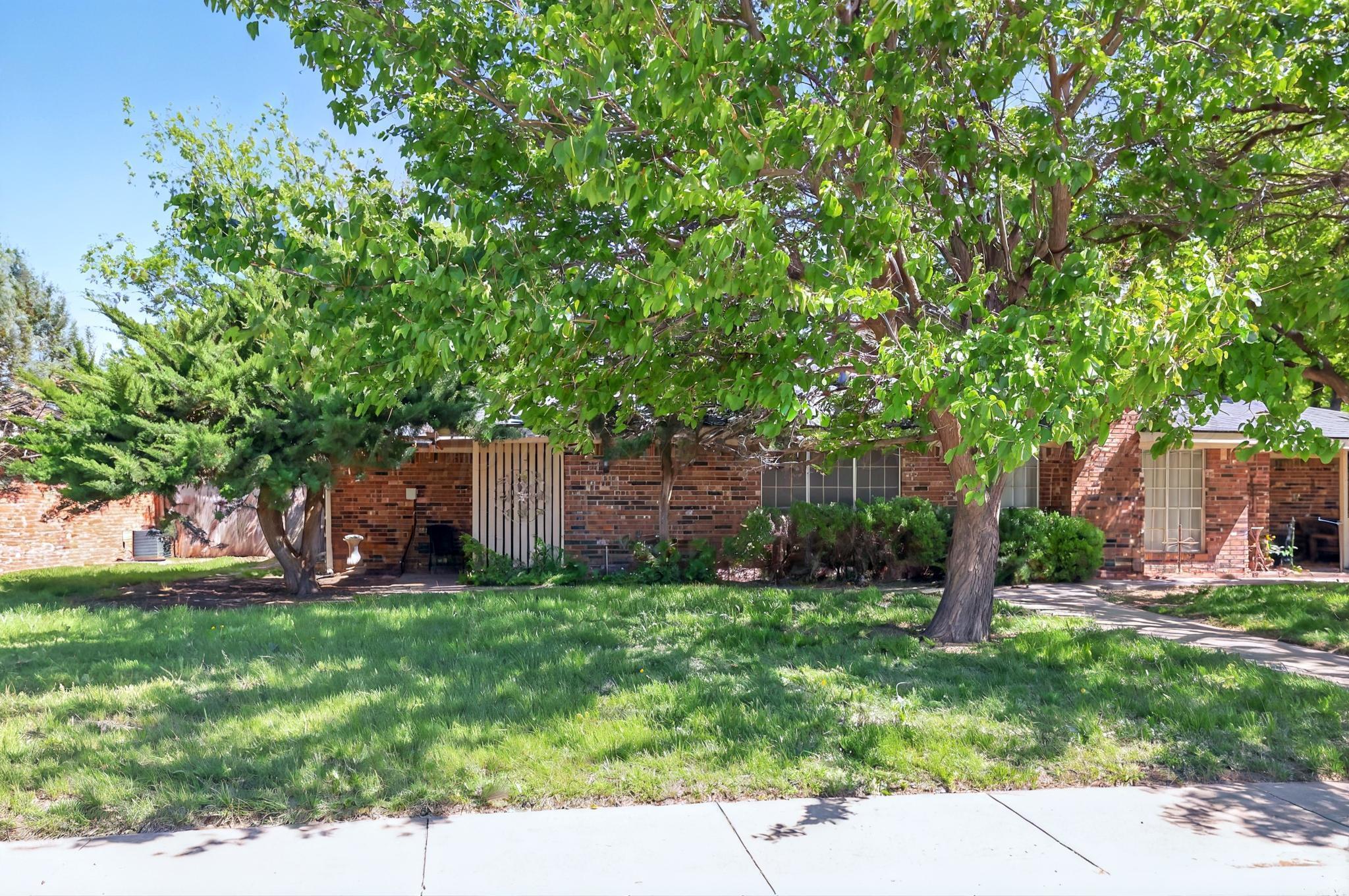6225-6227 Belpree Road Amarillo, TX 79106 - Photo 2 of 31 a backyard of a house with lots of green space