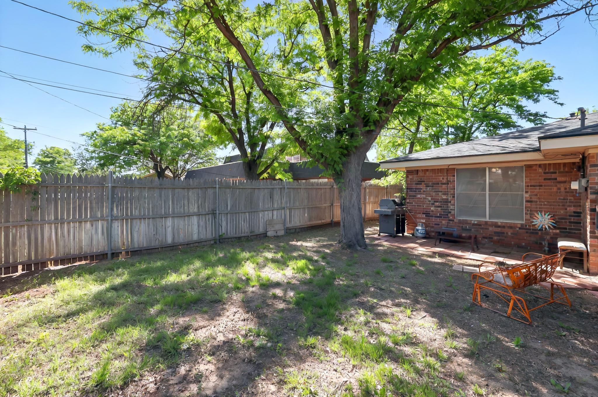 6225-6227 Belpree Road Amarillo, TX 79106 - Photo 30 of 31 a view of a backyard with a patio