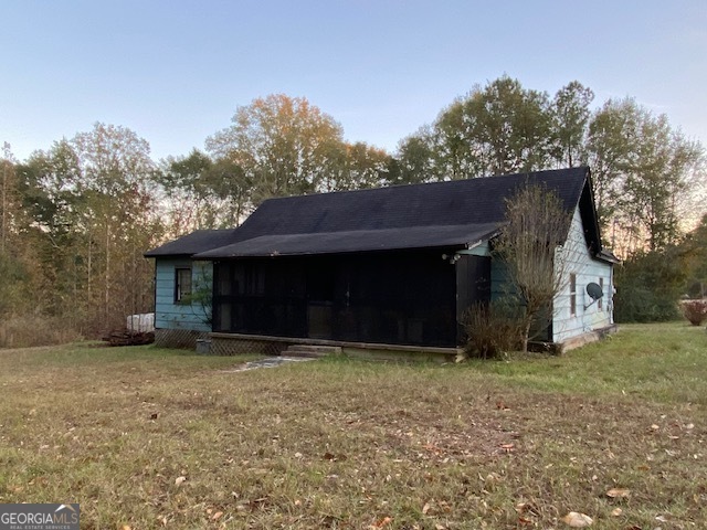 a view of a house with a yard and a garage
