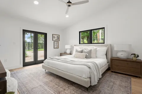 a bedroom with a bed and window