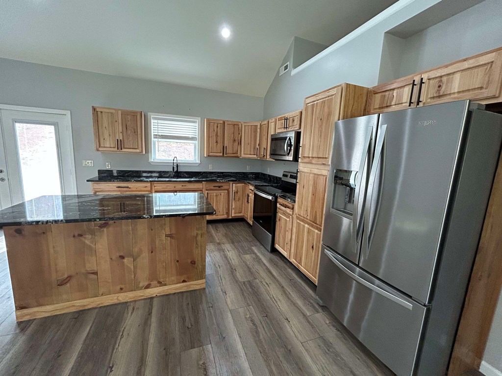 Undisclosed Address Hayesville, NC 28904 - Photo 3 of 11 a kitchen with granite countertop a refrigerator stove and sink