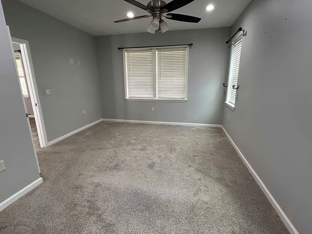 Undisclosed Address Hayesville, NC 28904 - Photo 6 of 11 an empty room with windows and fan