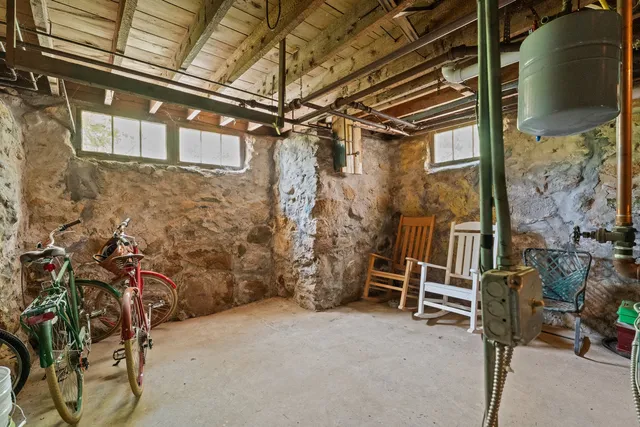a front view of a house with a yard covered with snow in front of house