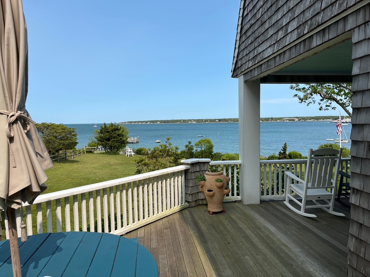 33 Goethals Way Vineyard Haven, MA 02568 - Photo 4 of 34 a view of a balcony with floor to ceiling window wooden floor and fence