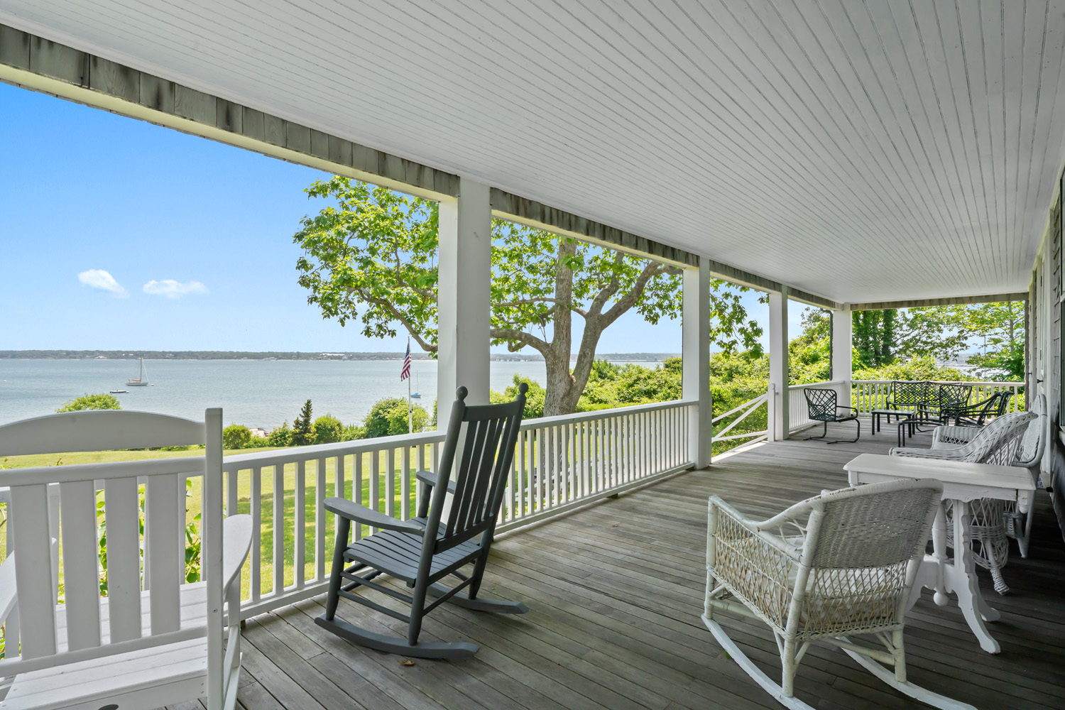 33 Goethals Way Vineyard Haven, MA 02568 - Photo 7 of 34 a view of a chairs and table in patio with wooden floor