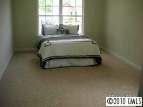 412 Danielle Way Fort Mill, SC 29715 - Photo 7 of 8 a bedroom with a bed and a window