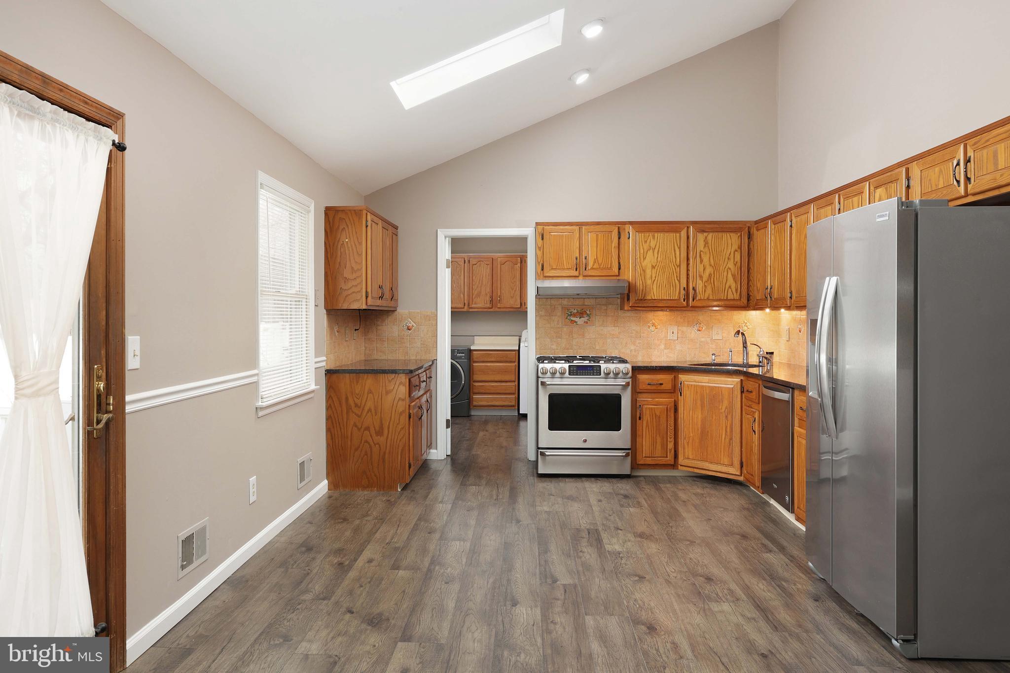 285 Manor Boulevard Hamilton, NJ 08620 - Photo 11 of 35 a kitchen with a refrigerator and a sink